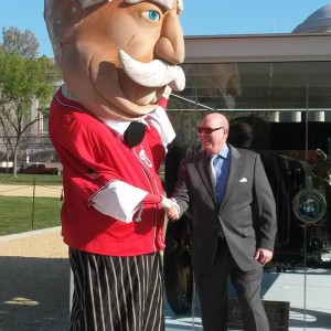 The National's Taft president mascot greets Taft biographer Michael Bromley in front of the first presidential automobile on display on the National Mall April 14-20, 2016.